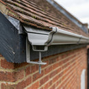 Moulded Ogee Gutter Rise and Fall Bracket 125 x 100mm — RAL 7036 (in use)