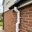Flush Joint Adjustable Swanneck 63mm Downpipe Connector — RAL 9010 (in use)