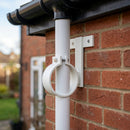 Adjustable Aluminium Pipe Clip 63mm Diameter — RAL 9010 (in use)