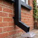 Flush Joint Aluminium Downpipe Bend 72x72mm — Textured Black / 112.5 Degrees (in use)