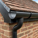 Half Round Aluminium Gutter Outlet 63mm Dia. 125mm — Textured Black (in use)