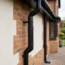 Flush Joint Adjustable Swanneck 63mm Downpipe Connector — RAL 9005 (in use)