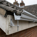 Moulded Ogee Gutter Rise and Fall Bracket 125 x 100mm — RAL 9006 (in use)