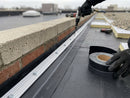 Black EPDM reinforced perimeter fastening strip installed and mechanically fastened at a flat roof upstand