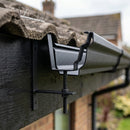 Moulded Ogee Gutter Rise and Fall Bracket 125 x 100mm — Textured Black (in use)