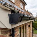 Moulded Ogee Gutter Left Hand Stop End 125 x 100mm — Textured Black (in use)
