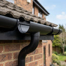 Half Round Aluminium Gutter Outlet 63mm Dia. 125mm — RAL 9005 (in use)