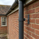 Adjustable Aluminium Pipe Clip 63mm Diameter — RAL 7021 (in use)