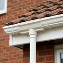 Moulded Ogee Gutter Outlet 63mm Dia, 125 x 100mm — RAL 9010 (in use)