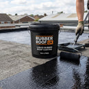Rubber Roof UK branded liquid rubber coating pail on a flat roof, coating being roller-applied