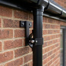 Adjustable Aluminium Pipe Clip 63mm Diameter — RAL 9005 (in use)