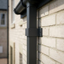Aluminium Downpipe Clip 72×72mm with 5mm Wall Spacing — RAL 7021 (in use)