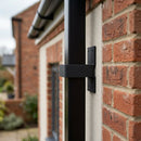 Aluminium Downpipe Clip 72×72mm with 5mm Wall Spacing — Textured Black (in use)