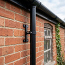 Adjustable Aluminium Pipe Clip 76mm Diameter — RAL 9005 (in use)