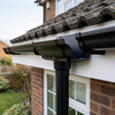 Moulded Ogee Gutter Outlet 63mm Dia, 125 x 100mm — RAL 9005 (in use)