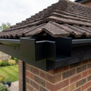 135° Aluminium Box Gutter Angle 135 x 100mm — RAL 9005 (in use)