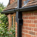 72x72mm Flush Joint Aluminium Downpipe Shoe — Textured Black (in use)