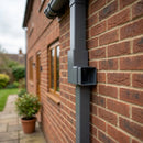 Flush Joint Aluminium Downpipe Bend 72x72mm — RAL 7037 / 92.5 Degrees (in use)