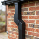 Flush Joint Aluminium Downpipe Bend 72x72mm — RAL 9005 / 112.5 Degrees (in use)