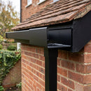 Aluminium Box Gutter Outlet 72×72mm to 135×100mm — RAL 9005 (in use)