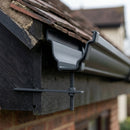 Moulded Ogee Gutter Rise and Fall Bracket 125 x 100mm — RAL 7021 (in use)