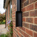63mm Aluminium Downpipe Access Plate — Textured Black (in use)