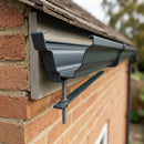 Moulded Ogee Gutter Rise and Fall Bracket 125 x 100mm — RAL 7016 (in use)