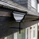Moulded Ogee Gutter Rise and Fall Bracket 125 x 100mm — RAL 9005 (in use)