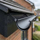 Half Round Aluminium Gutter Side Rafter Bracket 125mm — Textured Black (in use)