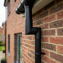76mm Diameter Flush Joint Aluminium Downpipe Bends — RAL 7016 / 92.5 Deg (in use)