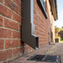 72x72mm Flush Joint Aluminium Downpipe Shoe — RAL 7022 (in use)