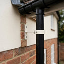 Adjustable Aluminium Pipe Clip 63mm Diameter — RAL 9010 (in use)