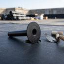 Close-up of black EPDM industrial roof drain connector spigot and deep 600mm pipe section before bonding