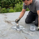 Roofer patch-repairing an existing GRP roof with resin and matting, RUBBER ROOF UK branded repair kit