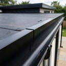 Black uPVC roof edge trim installed on a flat roof EPDM membrane edge