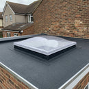 Polycarbonate fixed dome rooflight installed on a kerb upstand on an EPDM flat roof extension
