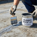 Applying crack-bridging repair paint to a flat roof, RUBBER ROOF UK branded tin