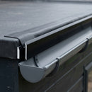 Black uPVC gutter drip trim installed at a flat roof edge with EPDM membrane dressed over it above a gutter