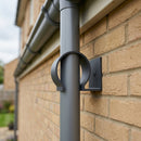 Aluminium Downpipe Clip 63mm Dia with 25mm Wall Offset — RAL 7021 (in use)