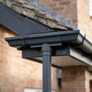 Moulded Ogee Gutter Outlet 63mm Dia, 125 x 100mm — RAL 7021 (in use)