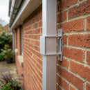Aluminium Downpipe Clip 72×72mm with 5mm Wall Spacing — RAL 9006 (in use)