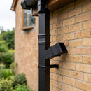 72x72mm Traditional Square Aluminium Downpipe Branches — RAL 9005 / 112.5 Degrees (in use)