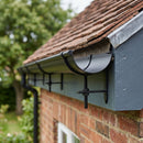 Half Round Aluminium Gutter Rise and Fall Bracket 125mm — RAL 9005 (in use)