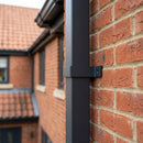 Aluminium Downpipe Clip 72×72mm Flush Joint — RAL 7021 (in use)