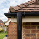 63mm Diameter Gutter Outlet Spigot Extender — RAL 9005 (in use)