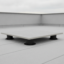 Adjustable paving support pedestals installed under porcelain paving slab on a flat roof terrace