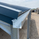 Deep box profile galvanised steel gutter installed under the eaves of a large agricultural steel shed