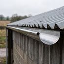 150mm galvanised steel half round gutter installed under the eaves of an agricultural steel-clad building