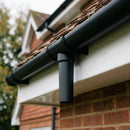 63mm Diameter Gutter Outlet Spigot Extender — Textured Black (in use)