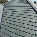 Pitched roof fully covered in natural grey-green slate tiles